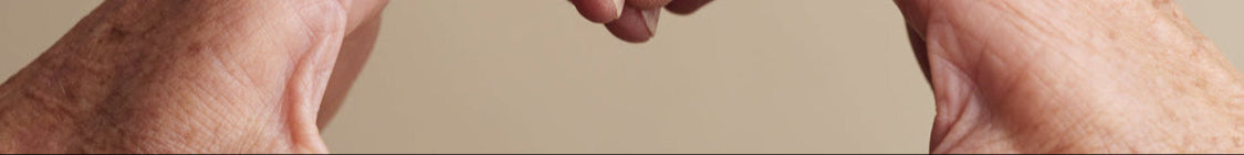 All rings from the Petal Heart collection worn on two hands in a heart shape