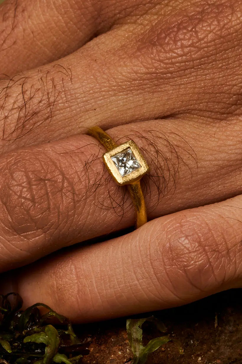 Clover Ring by Ada Hodgson with princess-cut diamond in a textured bezel setting