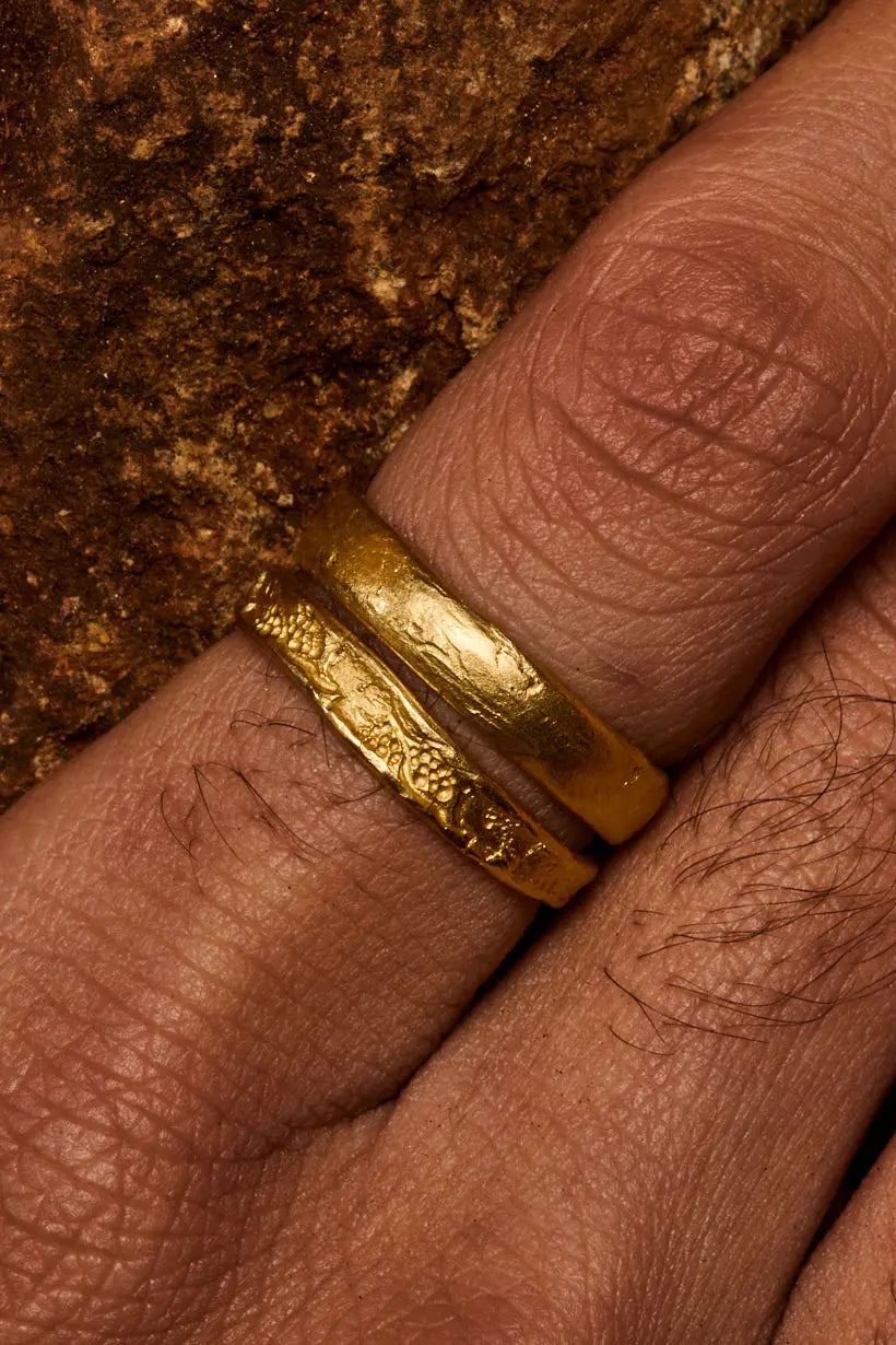 Grapevine Ring and Breeze ring worn on hand – softly detailed gold wedding bands with organic and natures inspired textures.