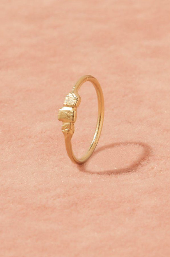 Tile Ring in gold, front view showing three asymmetric tiles