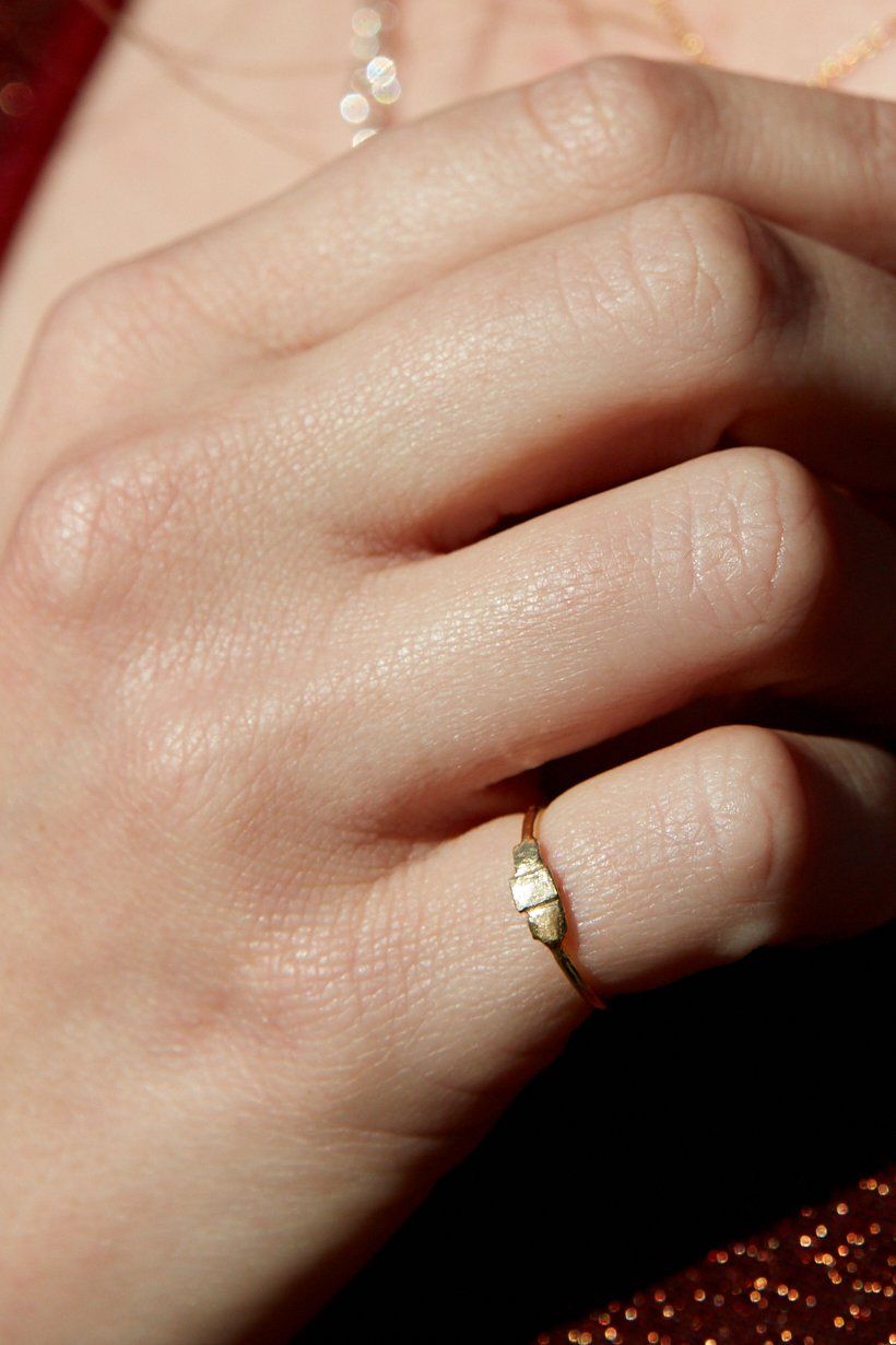Tile Ring in silver, worn alone on hand in soft natural light