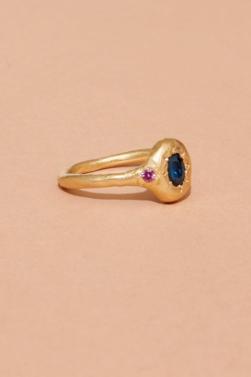 Monet’s Garden Ring styled in a flat lay with soft natural light, showing texture and colour