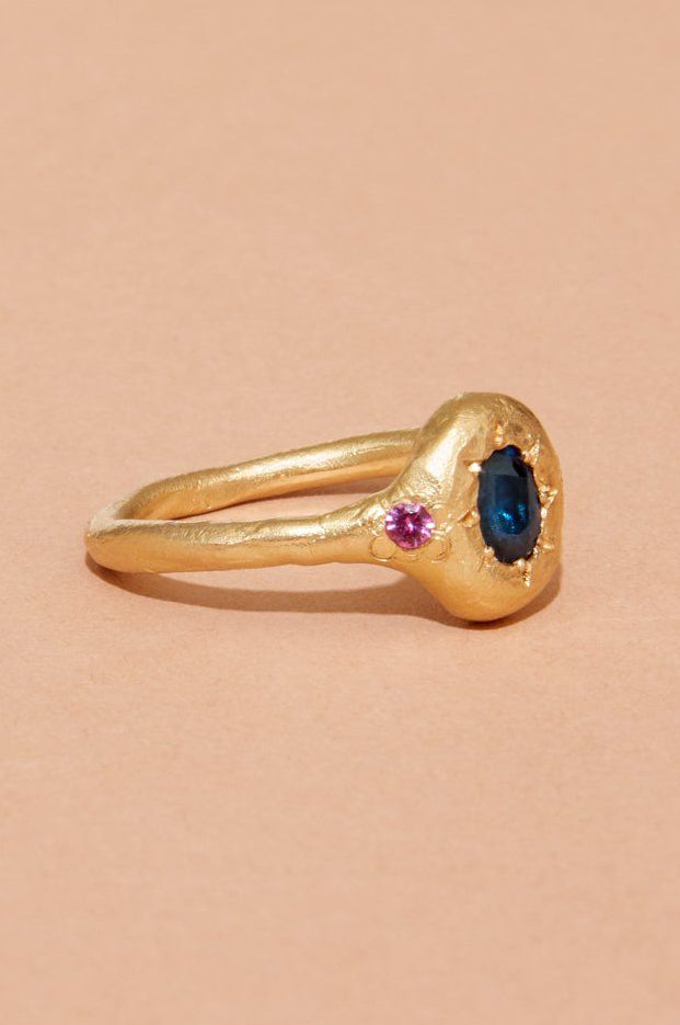 Monet’s Garden Ring styled in a flat lay with soft natural light, showing texture and colour