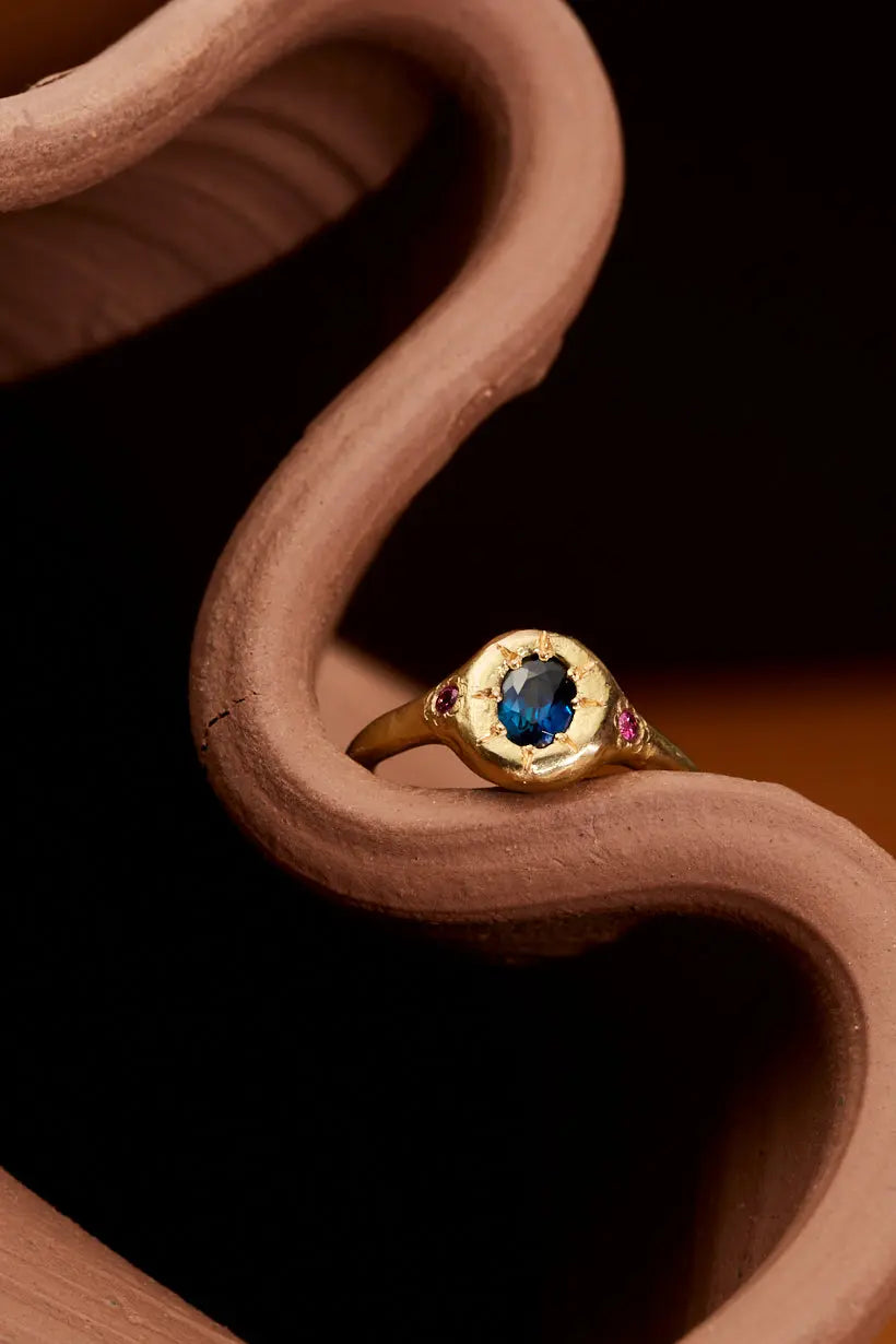 Organically textured gold band with radiant-set sapphires in the Monet’s Garden Ring