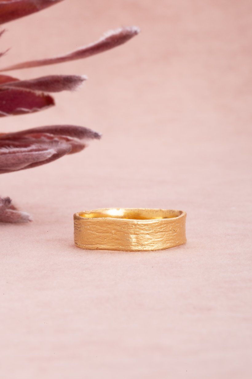Unisex gold wedding ring with organic bark texture