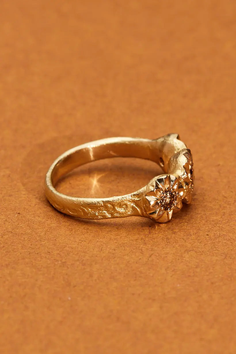 Engraved 18ct gold band of the Sunflower Ring with champagne diamonds