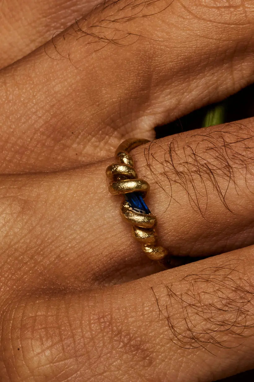 Stacking Vine Ring with Australian sapphire, worn alongside other gold bands