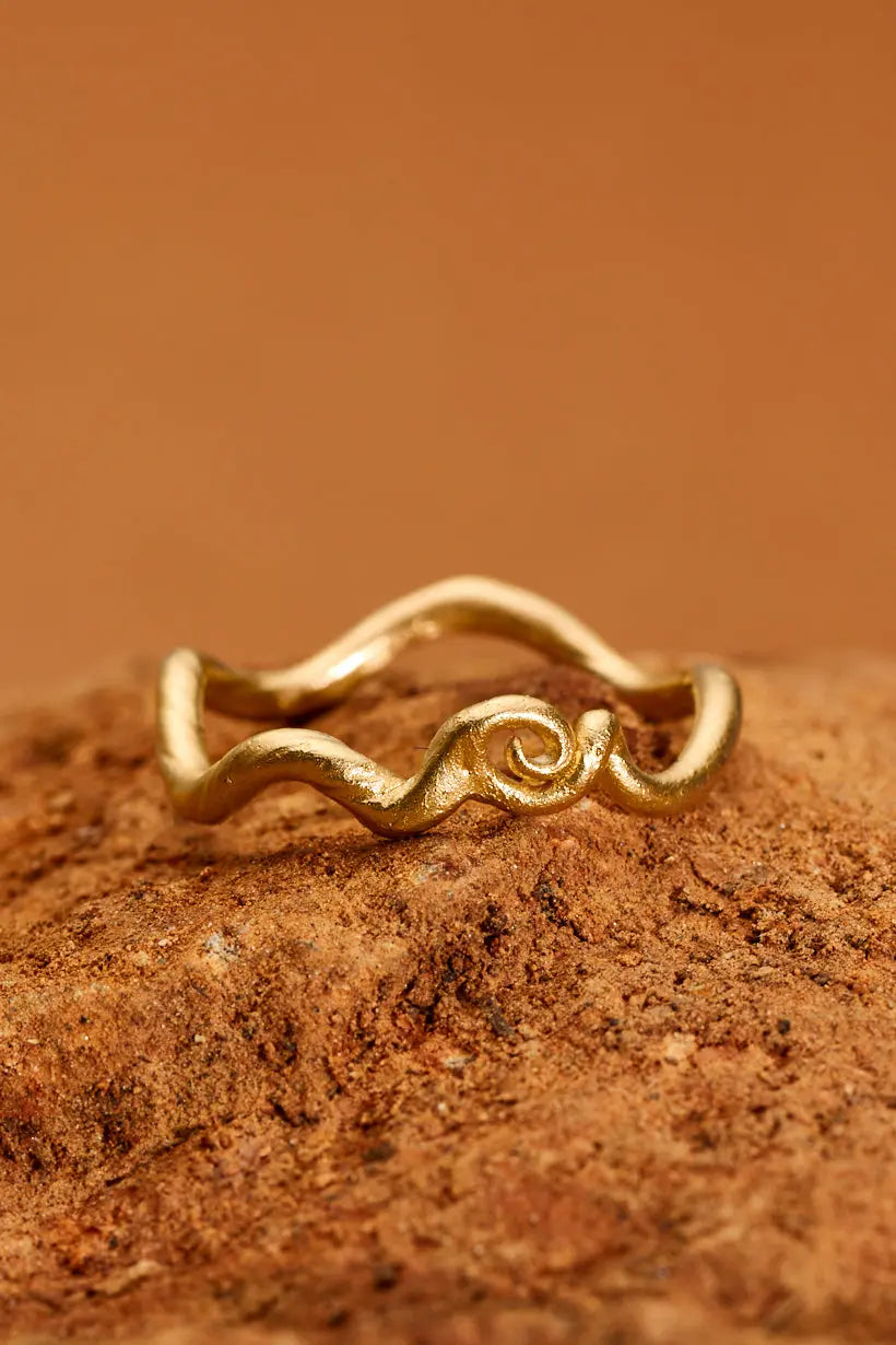 Gold stacking Tendril Ring close-up showing gentle organic curve and curl