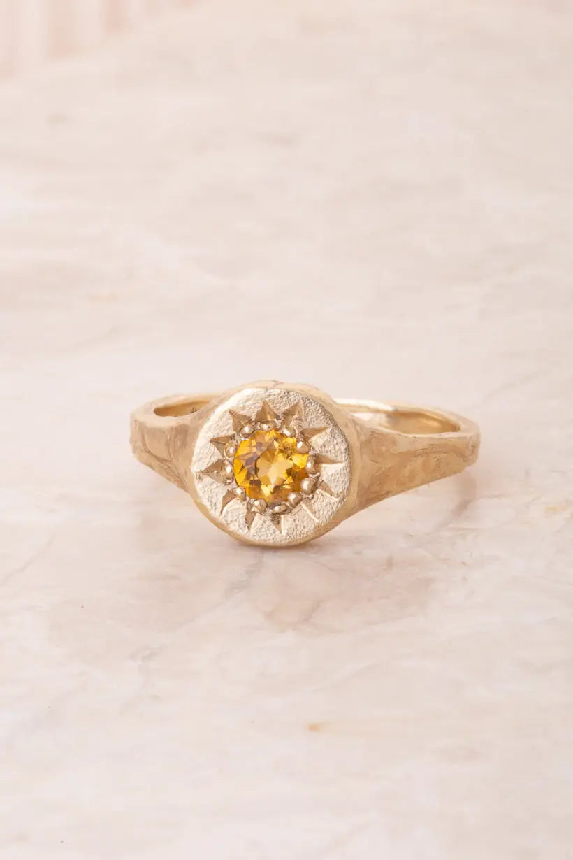 Floral Relic Ring in gold with citrine, front view on white background