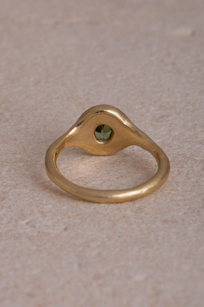 Back view of the Monet’s Garden recycled gold ring showing the open gallery beneath the green Australian sapphire