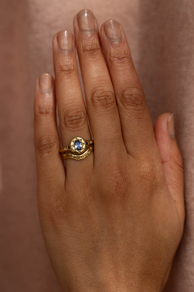 Monet's Garden Ceylon sapphire ring in recycled yellow gold stacked an engraved curved whisper wedding ring