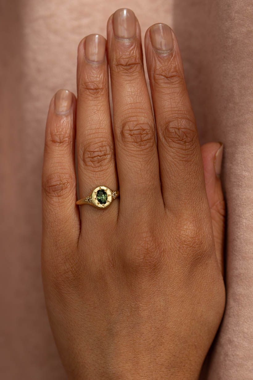 Monet's Garden Ring with green Australian sapphire and champagne diamonds in recycled yellow gold, worn on hand
