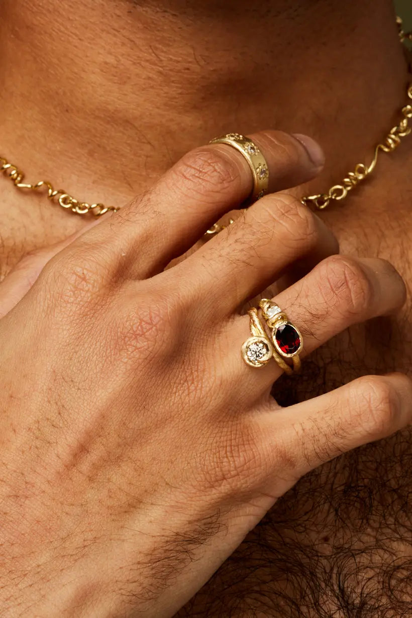 Model wears Daisy Chain ring, Bramble ring and Honeysuckle ring all golden garden inspired jewels handmade in Melbourne.